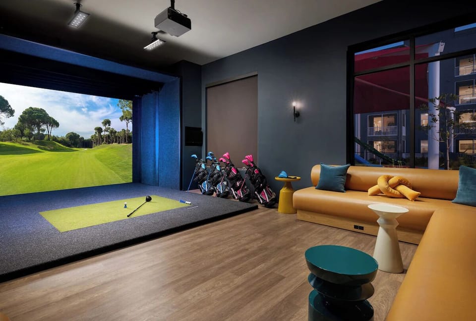 Play immersive virtual golf and unwind on plush lounge seating.