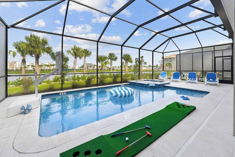 Dive into a sunny screened pool with playful putting green.