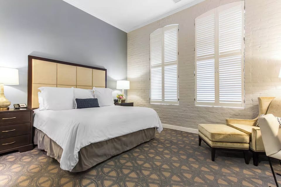 Wake up to gentle daylight beside a relaxing reading chair.