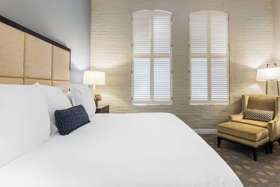 Enjoy soft morning light filtering through charming shuttered windows.