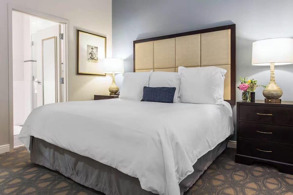 Stretch out in a bright king bed with calming tones.