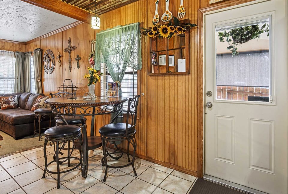 Step into comfort: A welcoming dining nook and a glimpse of the living area, perfect for relaxing after a day of adventure