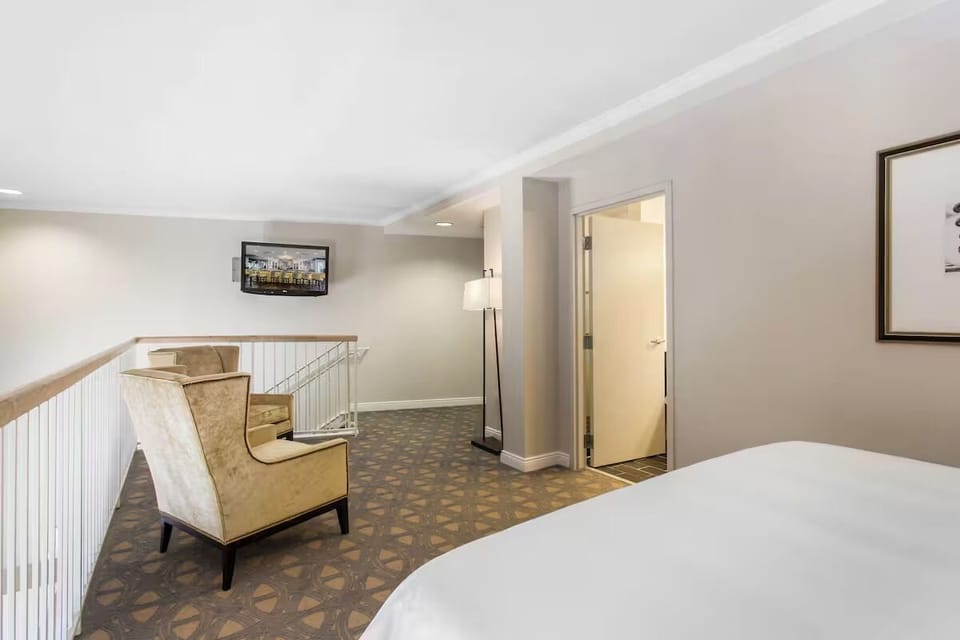 Spread out in your loft-style suite with cozy seating nook.