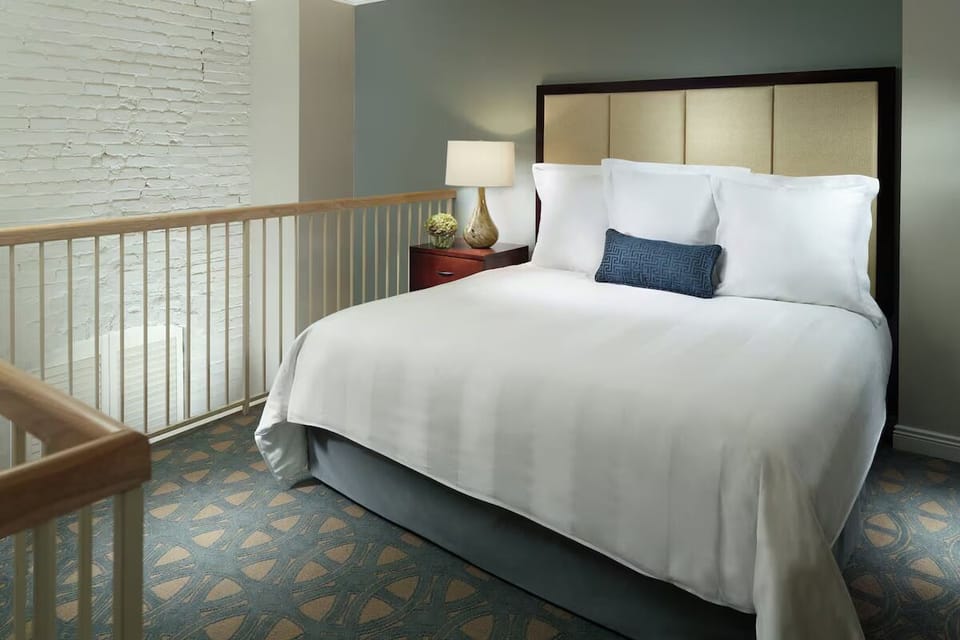Drift off in a plush bed with serene, airy styling.