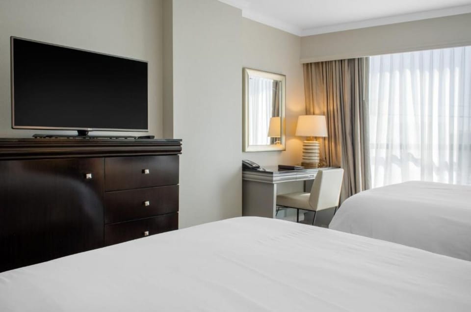 Kick back with in-room TV and a calm workspace.