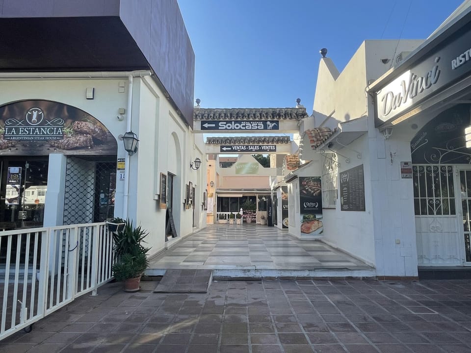 Doña Lola gallery with restaurants, bars, and two small supermarkets.