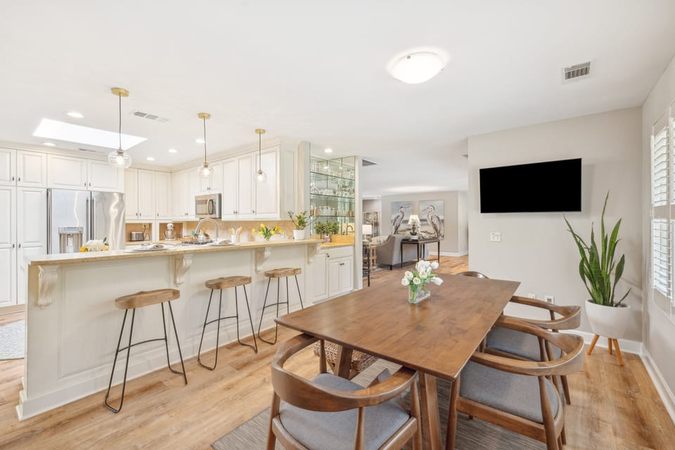 This beautifully updated kitchen and dining area creates an effortless space for cooking, gathering, and entertaining.