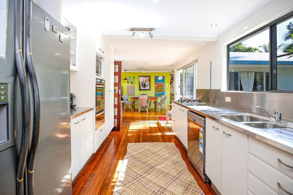 This fully equipped kitchen offers everything you need to prepare meals during your stay, including modern appliances, ample counter space, and a dining area perfect for gathering with family or friends.