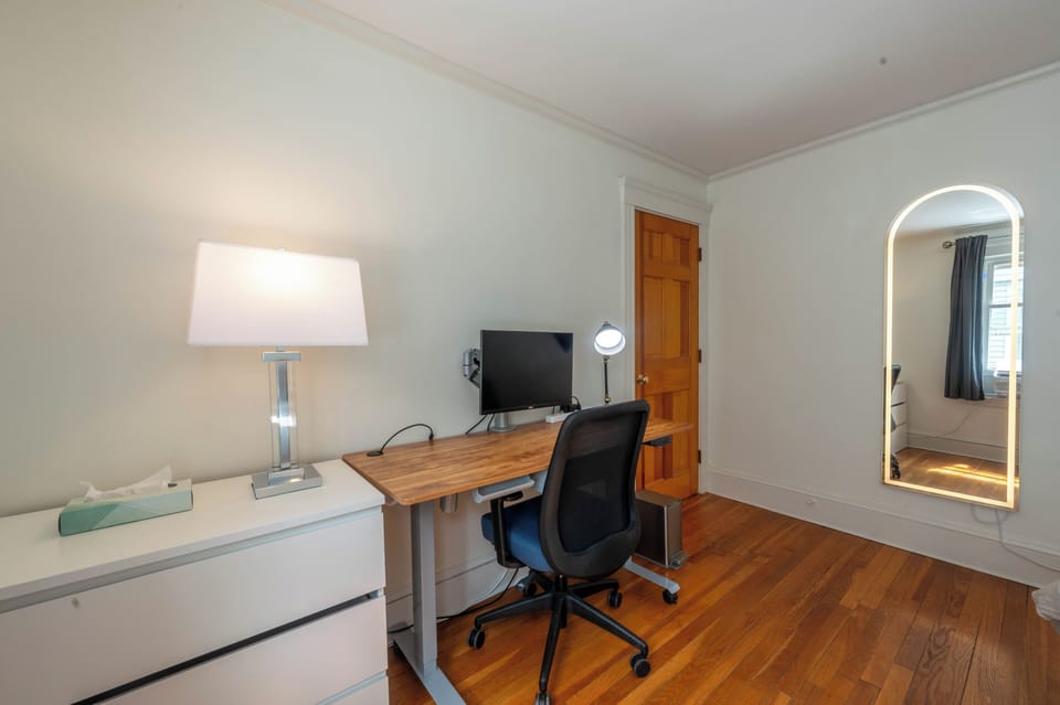 Standing desk with monitor. Note: Not available for use when baby crib required.