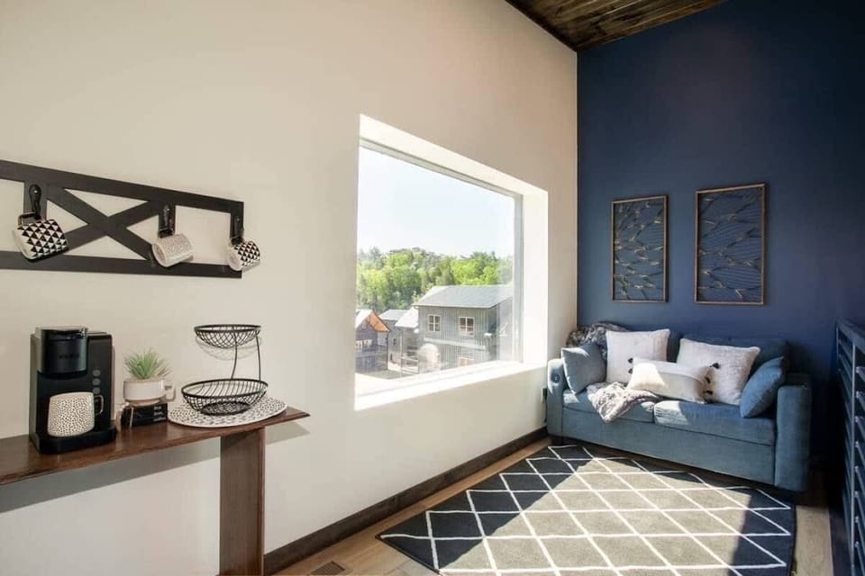 Upper level loft of sleeper sofa and coffee bar. 