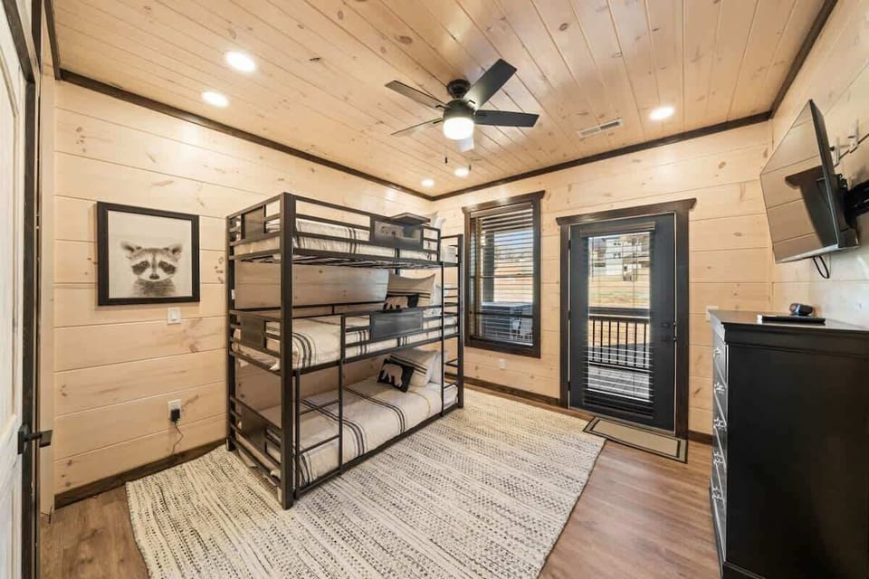 Bunk room view with back patio access. 
