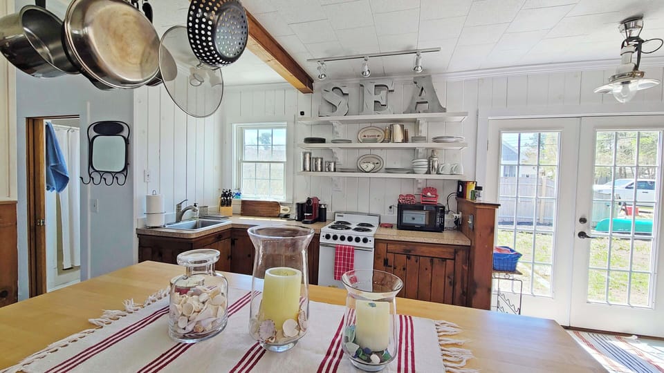 Nicely equipped kitchen is open to living room
