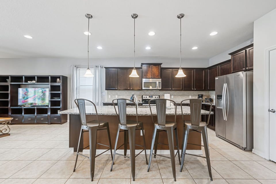 Cook with ease using high-end appliances, granite countertops, and everything needed for home-style meals