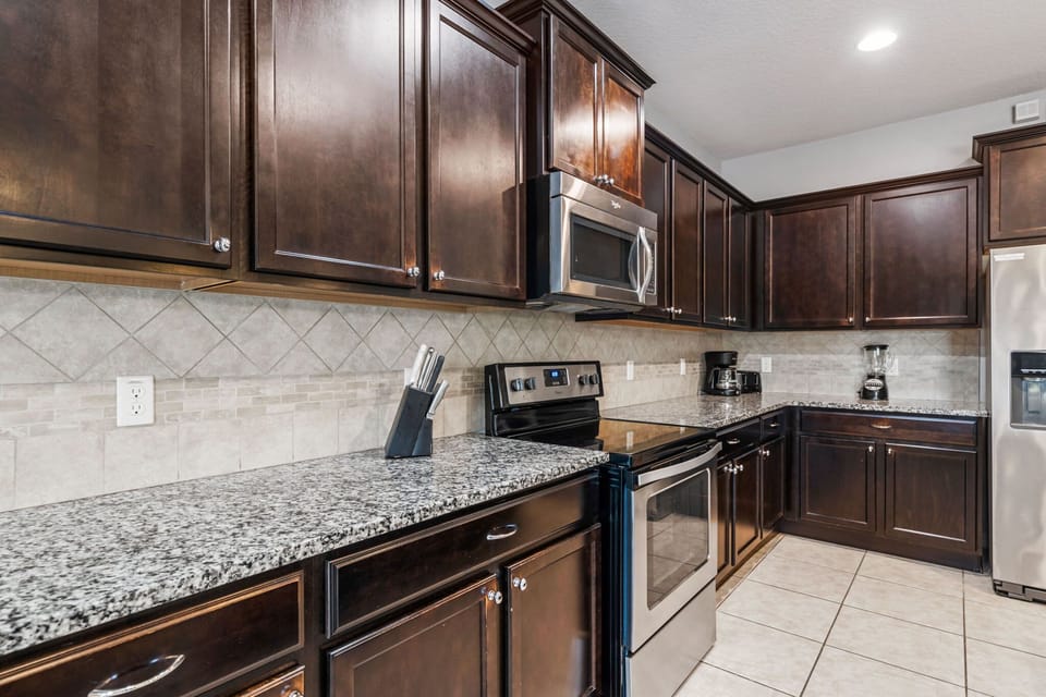 A spacious kitchen that connects beautifully to the dining and living areas — ideal for families and groups.