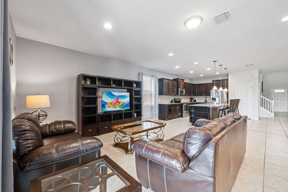 A stylish and inviting area seamlessly connected to the kitchen and dining space for easy family gatherings