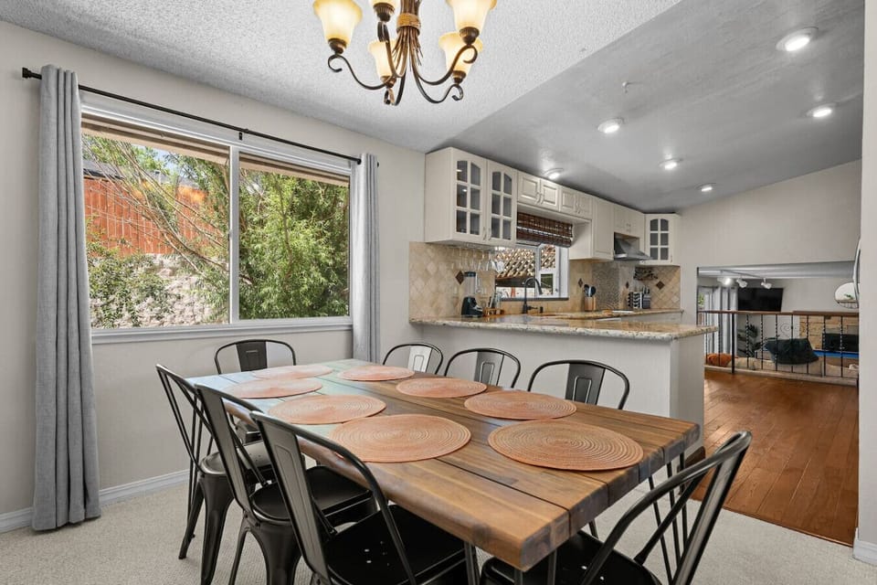 Cook, connect, and gather This open-concept kitchen and dining area is made for memory-making—enjoy home-cooked meals, laughter-filled game nights, and easy access to the game room just steps away!