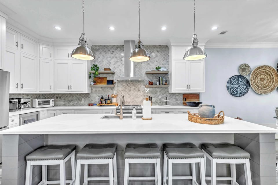 The chic, open kitchen offers ample space & every home comfort