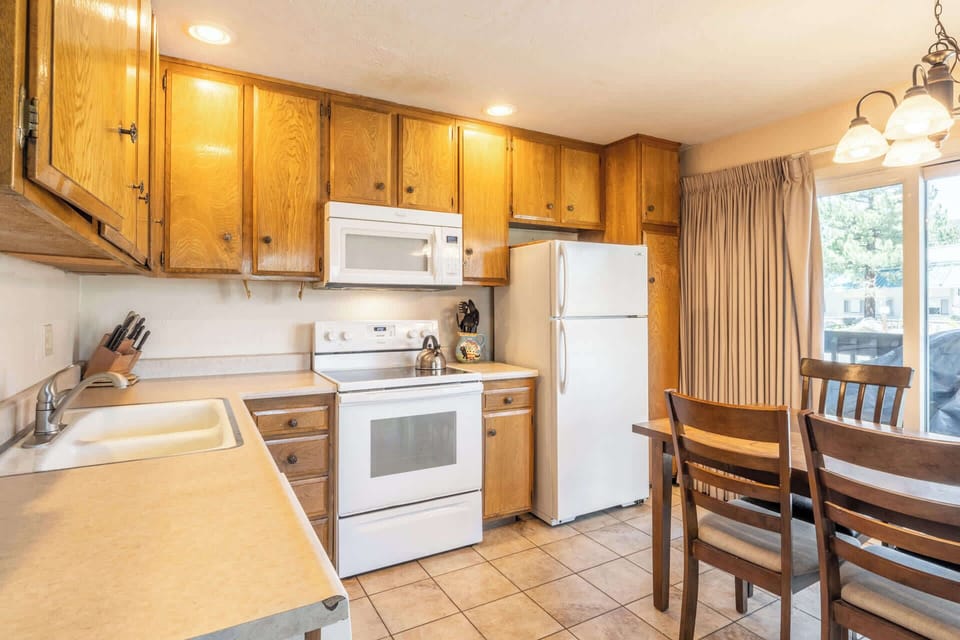 The open kitchen offers ample space & all the comforts of home