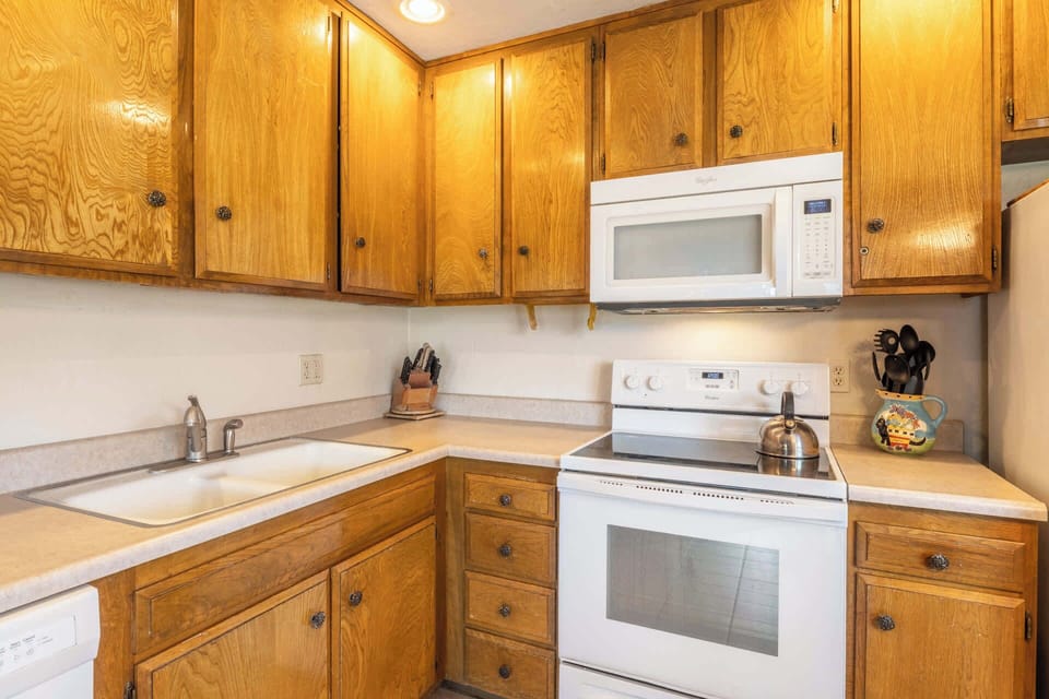 The open kitchen offers ample space & all the comforts of home