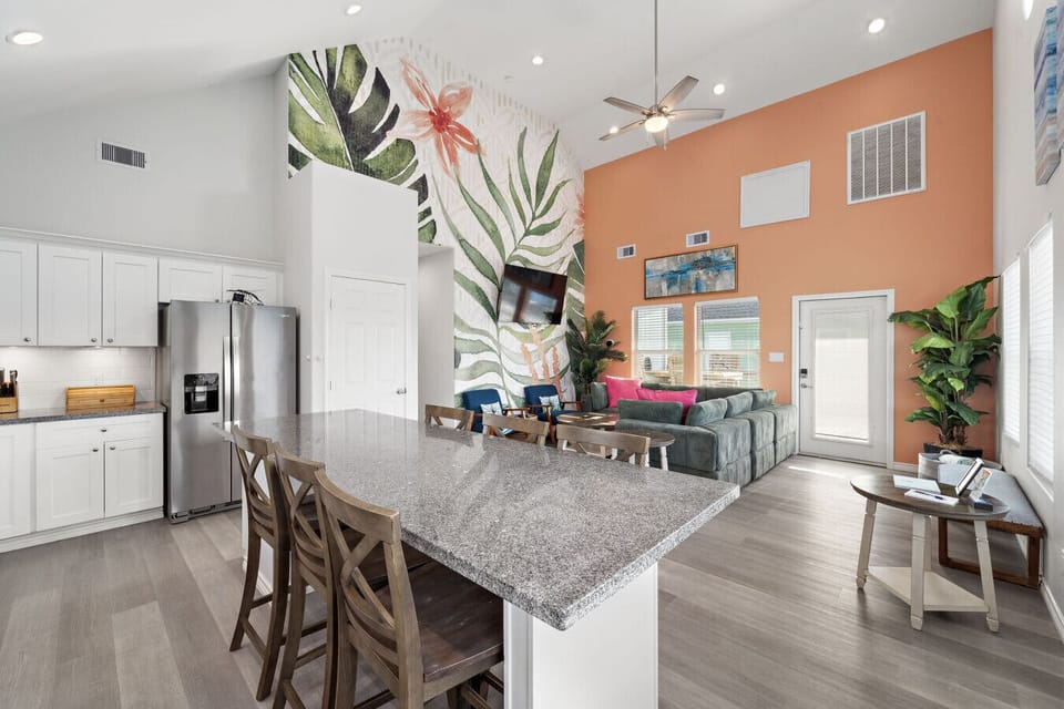 Open kitchen, dining, and living space for group meals and movie nights.