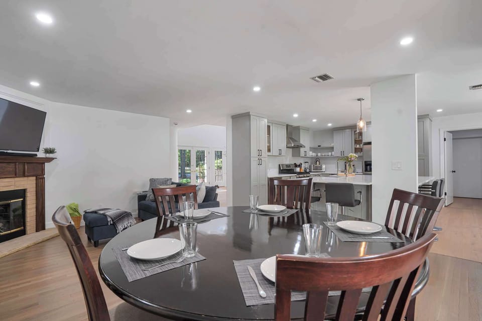 Dining area with table for six, open to kitchen and living room