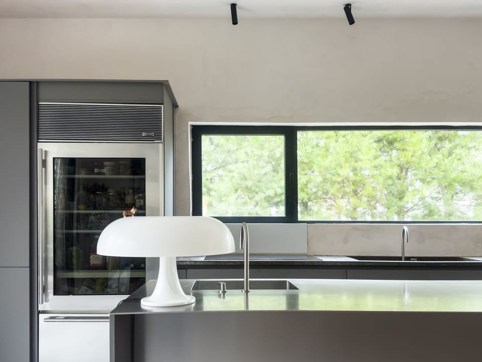 Chef’s Kitchen with European Appliances & Stainless Steel Counters