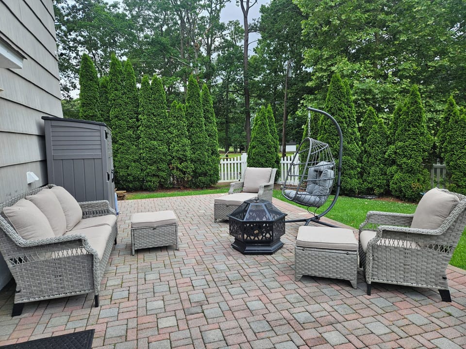 Back yard patio with firepit and gas grill.  