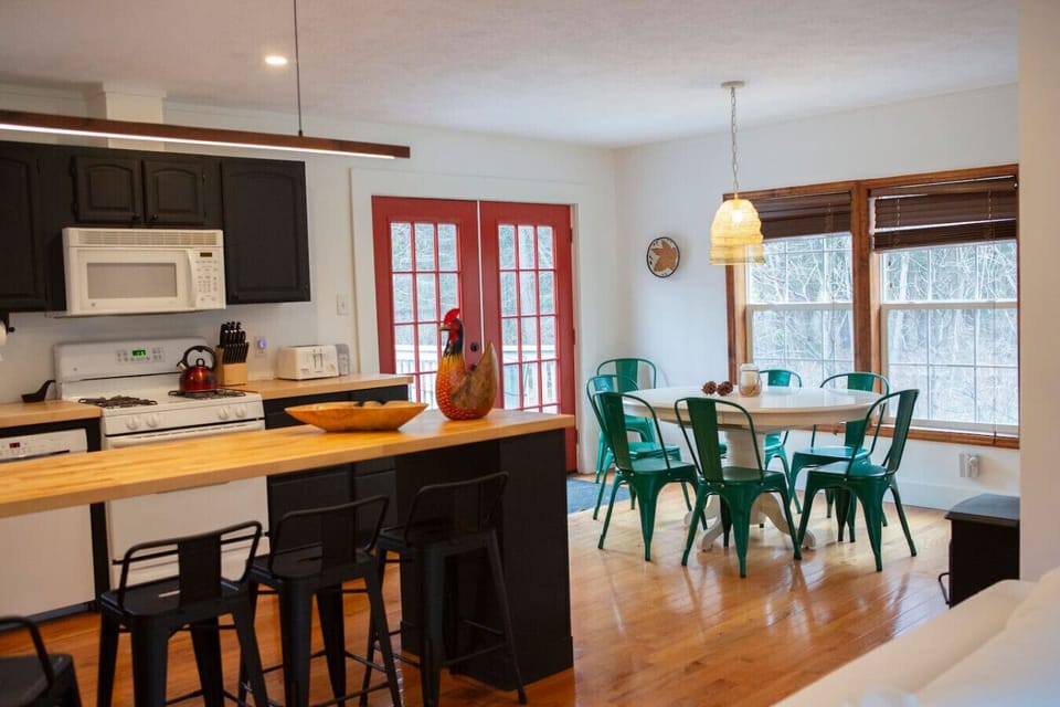 Open kitchen with island seating and dining area