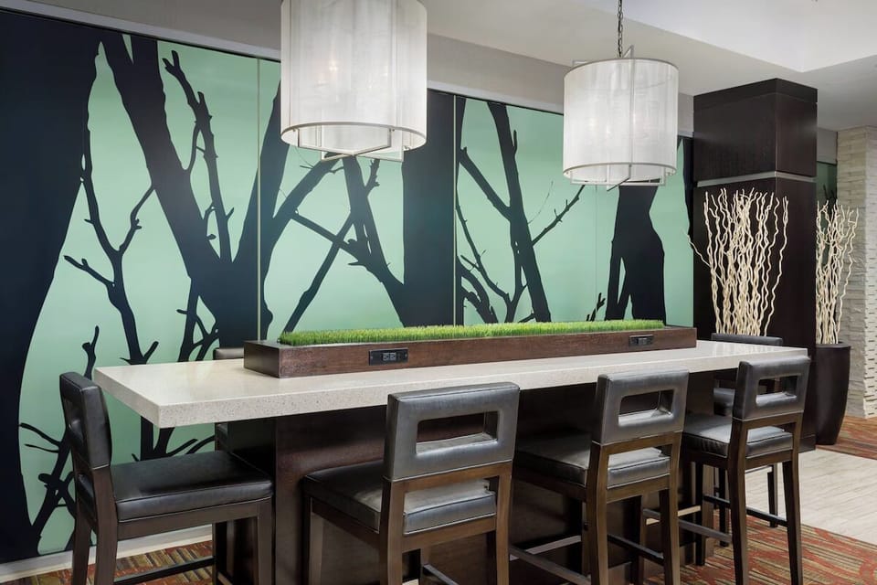 Plug in and recharge at the communal table and seating.