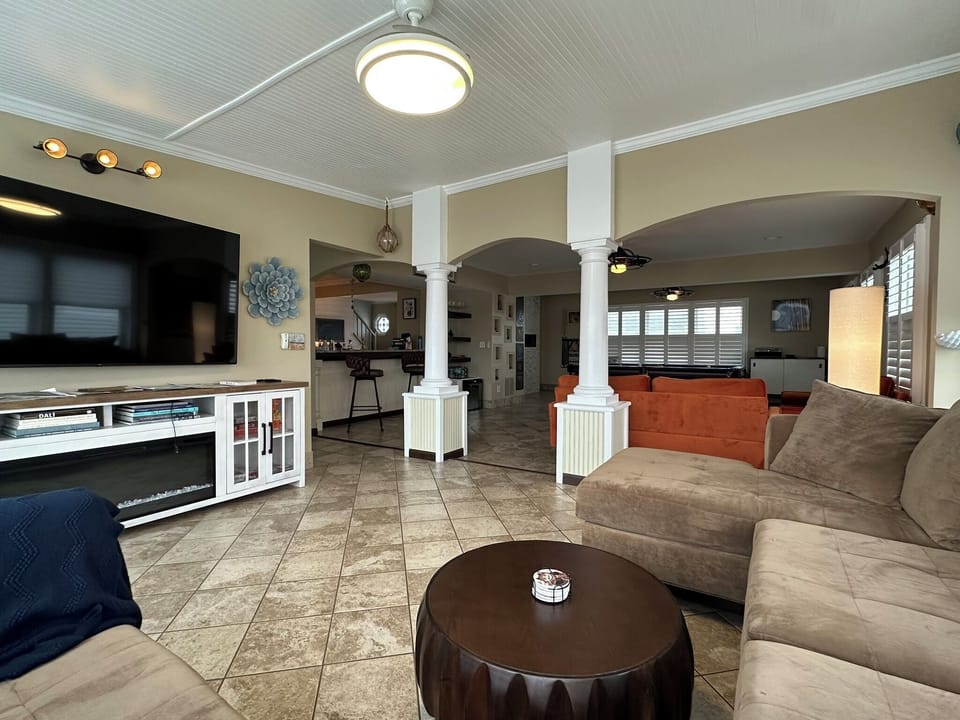 View from TV room into spacious pool table room. 