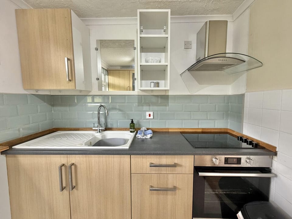 Well equipped galley kitchen with washing machine and tumble dryer