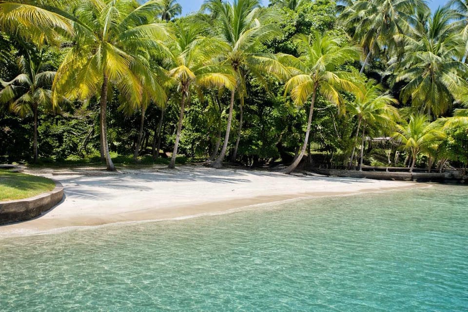 Arrive by boat to the lodge's beach access. Clear water, soft sand and palm trees line the shore, with larger beaches a short boat ride away.