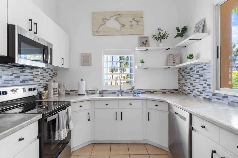 The bright, airy design creates a welcoming atmosphere, perfect for family gatherings or quiet meals. Enjoy the blend of functionality and charm that makes this space the heart of your home.