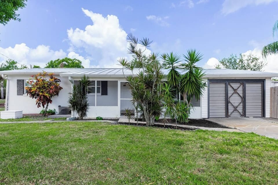 Front of property with driveway for parking 2 cars