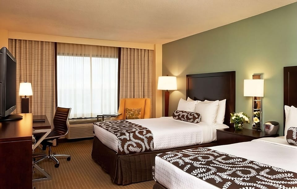 Unwind in a spacious room with two cozy beds.