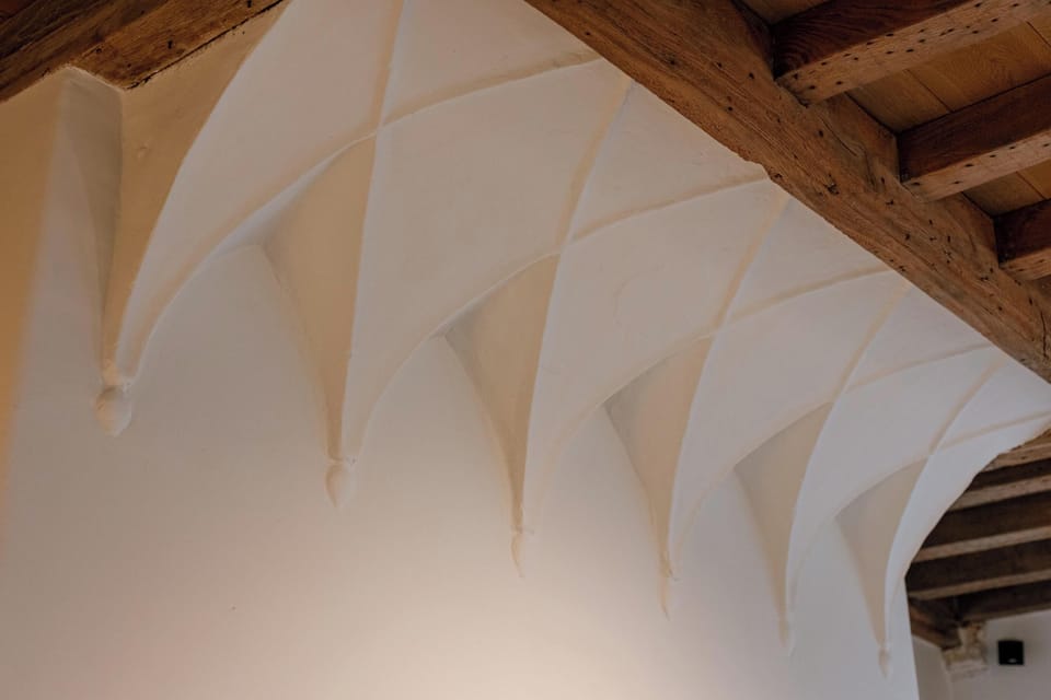 Vaulted ceiling detail celebrating the home’s original architecture.
