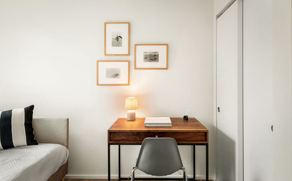 A full-size daybed paired with a laptop-friendly workspace—perfect for relaxing or getting things done.
