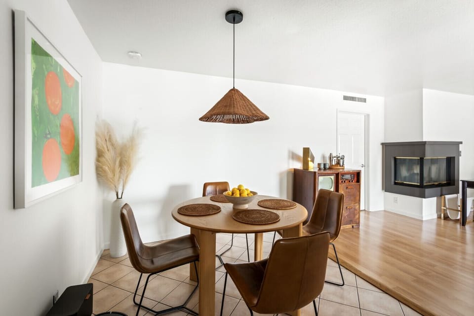Gather around this beautiful round wooden dining table, comfortably seating four for casual meals or intimate dinners.