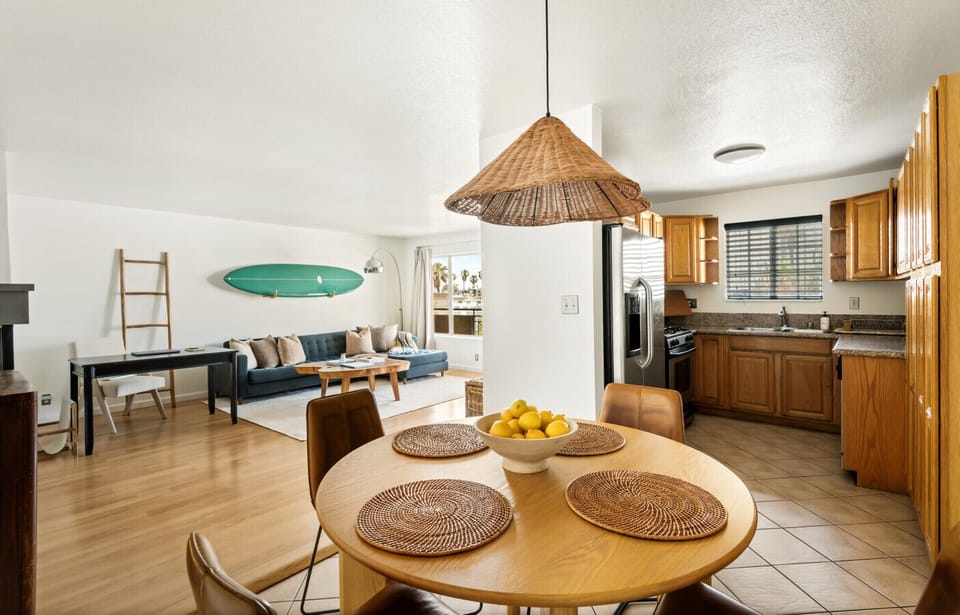 Gather around this beautiful round wooden dining table, comfortably seating four for casual meals or intimate dinners.