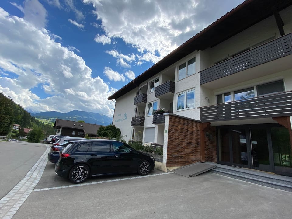 View of the house with ample parking and a quiet street.