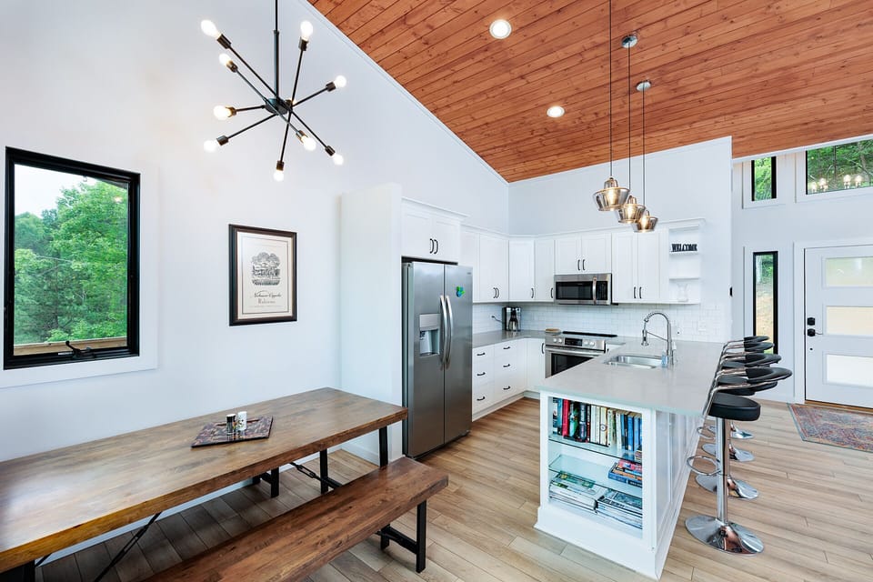 bright modern kitchen and dining area of entry level