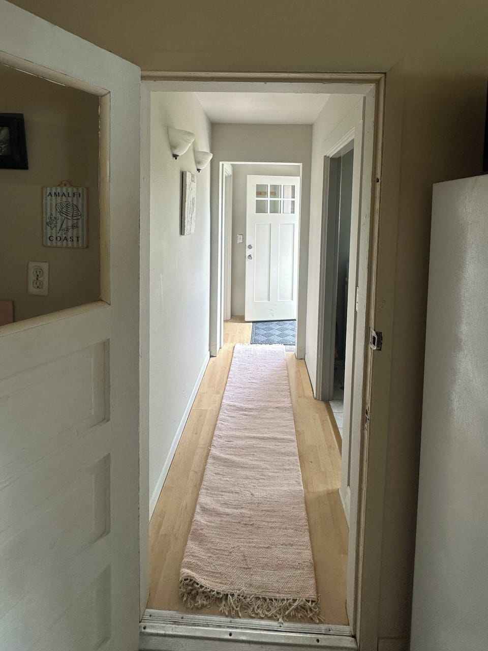 Hallway from Kitchen to Laundry RM, 2nd BDRM, and Backdeck.
