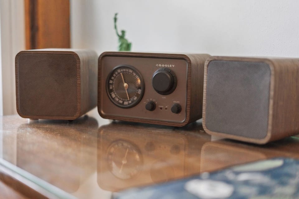 Tune into your favorite stations with this vintage-inspired Crosley radio system, perfectly positioned for relaxing evenings in your stylish retreat.