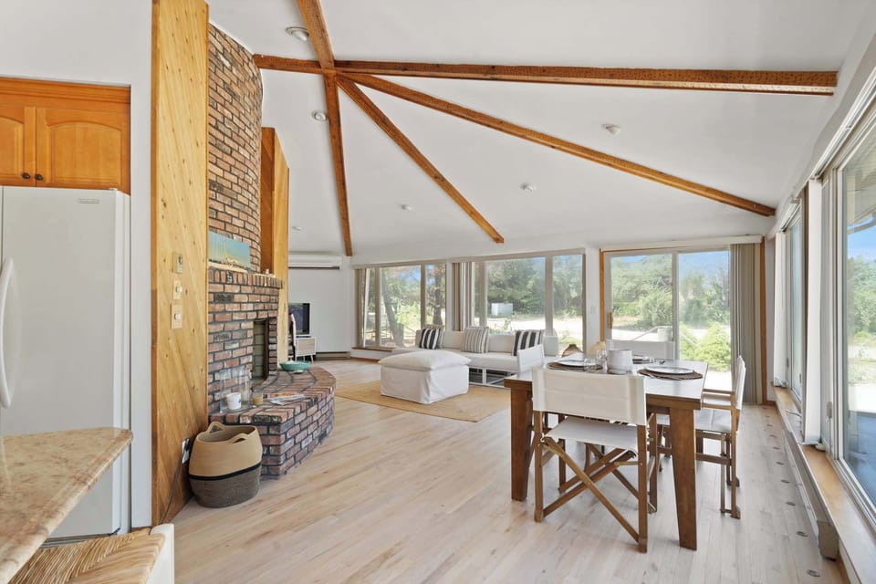 Open-concept dining area with high ceilings