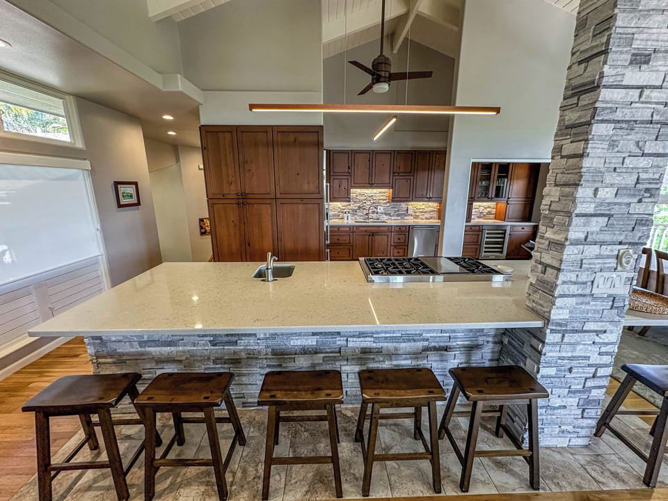 Beautifully designed full kitchen with center island grill, and bar seating!