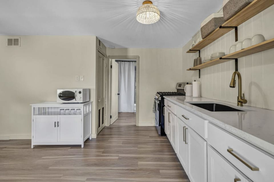 Fully stocked kitchen with Keurig, toaster, microwave & more