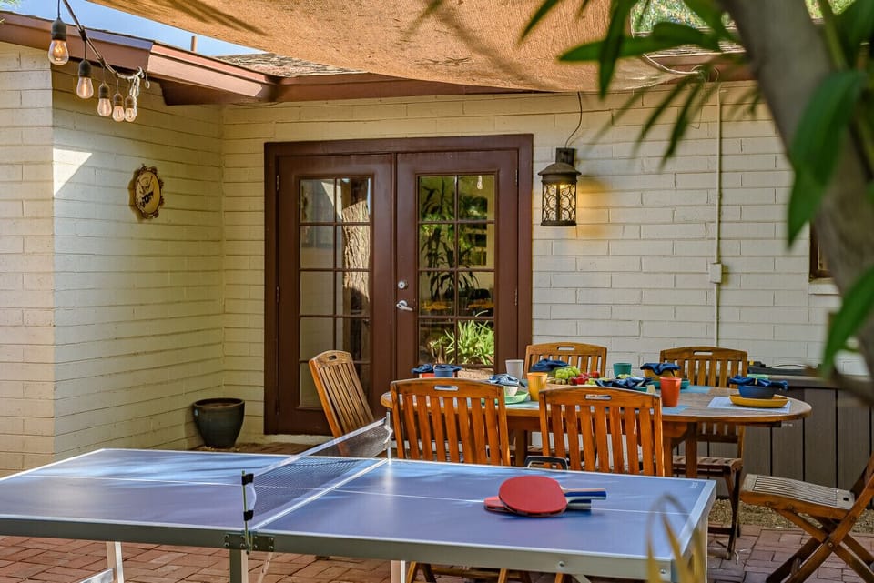 From cues to cocktails: enjoy a shaded pool table in the private backyard, just steps from a spacious dining setup for six. The ultimate spot for casual games and evening hangouts.