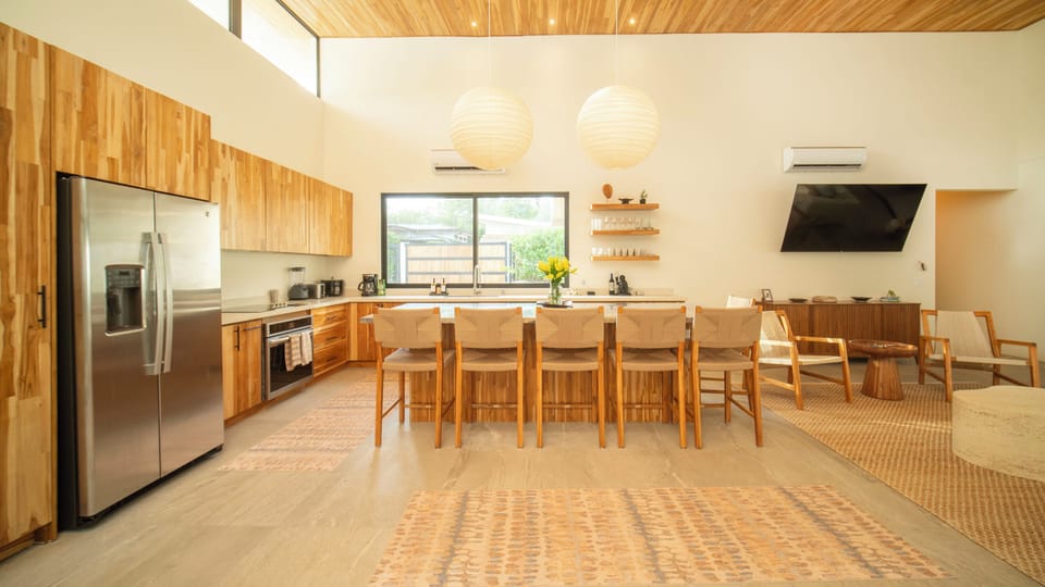 Kitchen with bar that seats 6