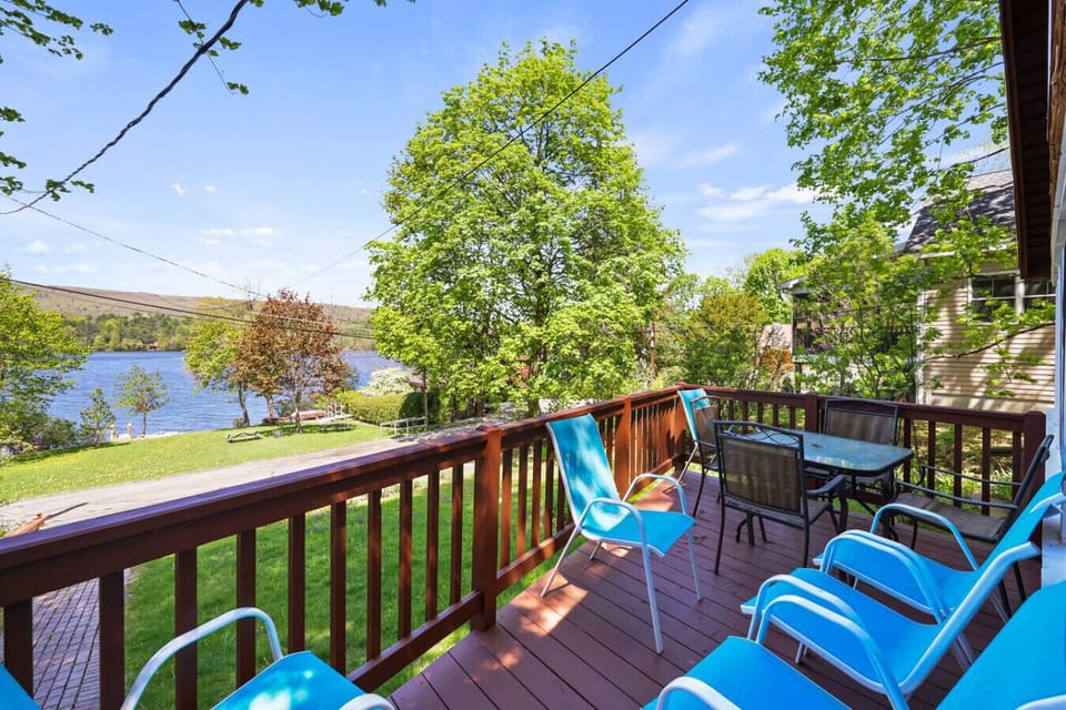 Elevated deck with comfortable outdoor seating and stunning lake views.