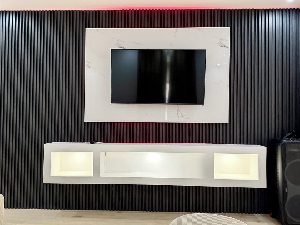 TV with LED backdrop.